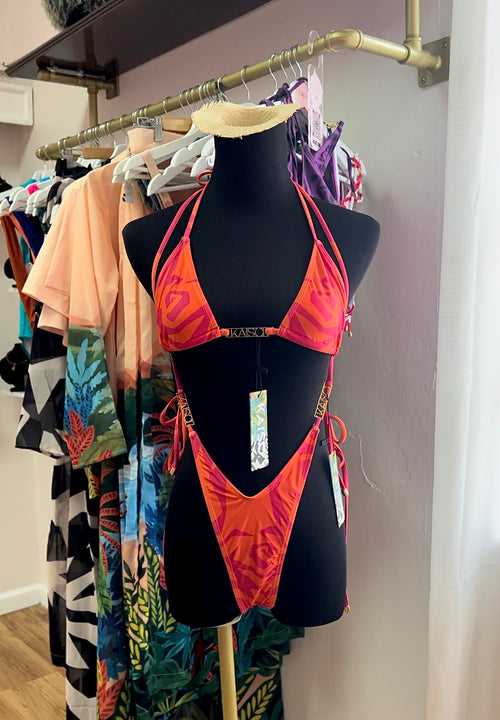 Front of Orange and Pink bikini with gold details on mannequin