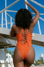 Back of Orange cross-neck one-piece swimsuit on body